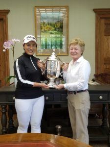 Se Ri Pak, 1998 US Women's Open Champion, holding the winner's trophy with Shoal Creek Resident/Member/Board of Directors and USWO Executive Commitee Member, Martha Lang, in the Shoal Creek Properties' office