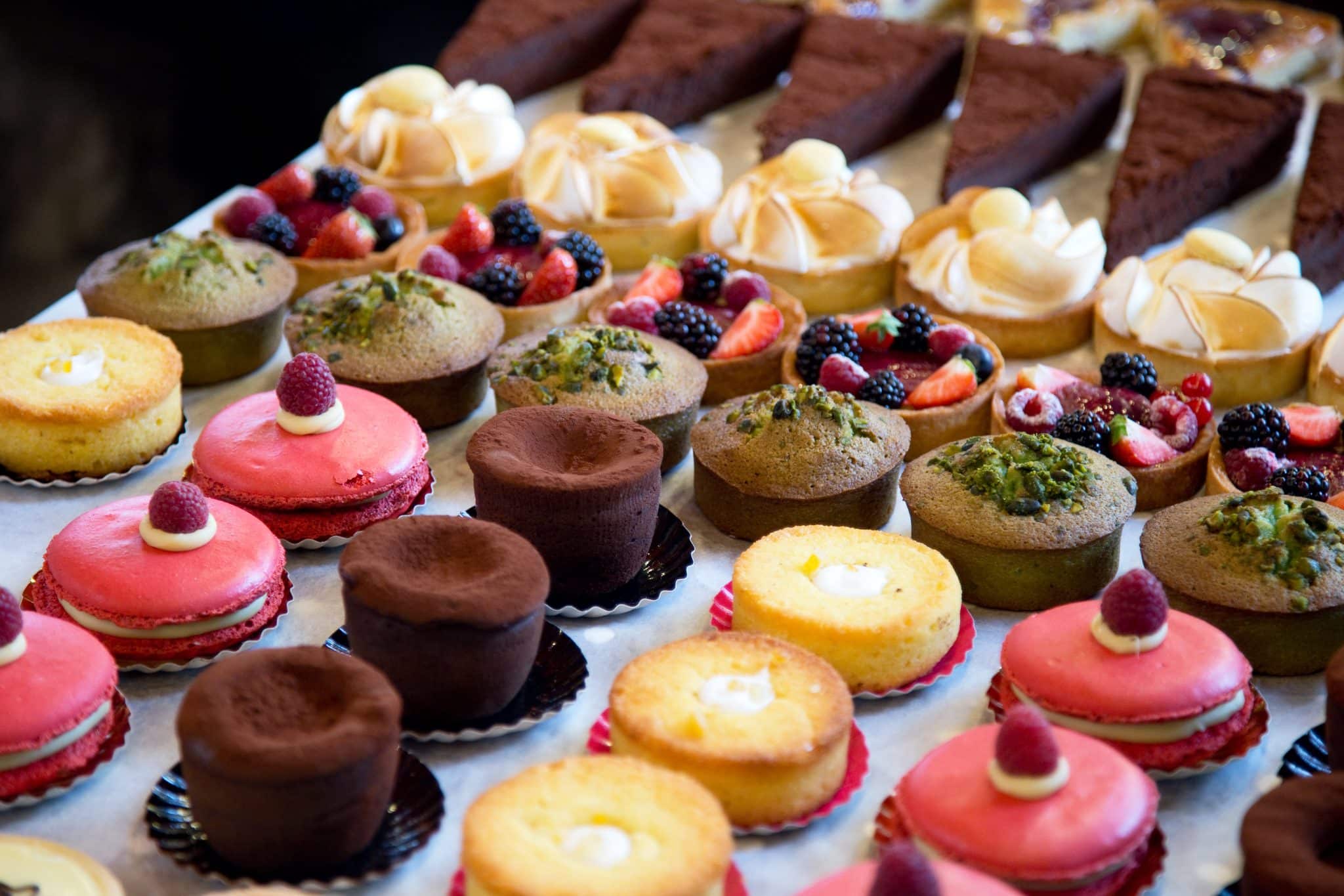 A selection of beautiful custom desserts in a bakery display