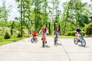 A group of children on their bicycles play at a Shoal Creek home