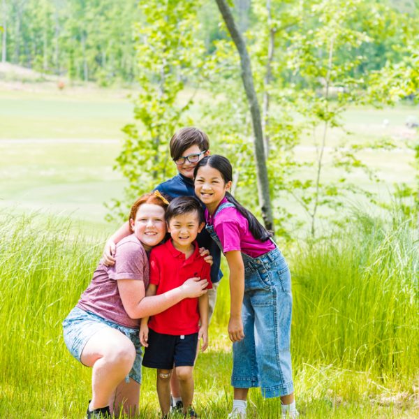 Fours kids posing and smiling for the photo