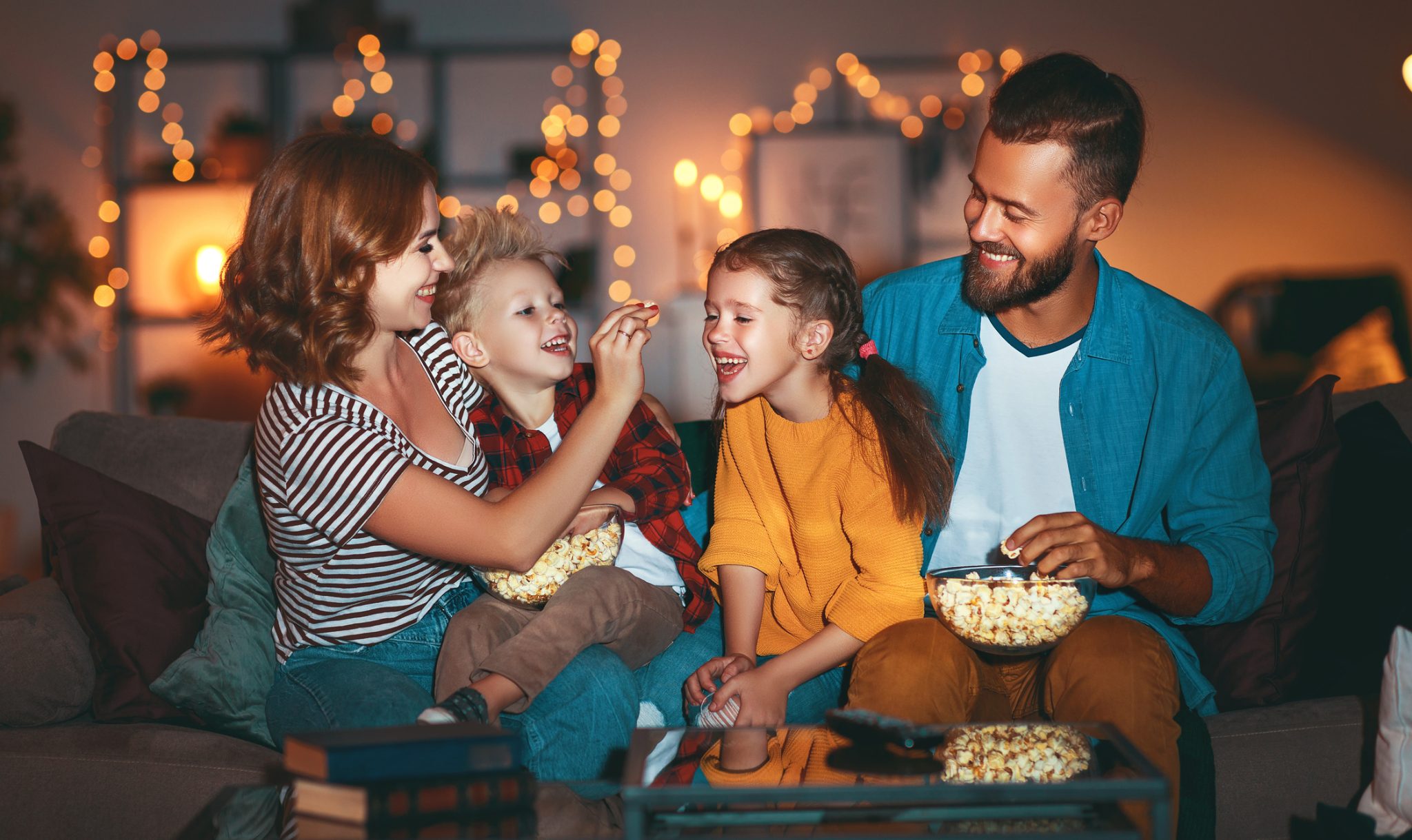 A family enjoying their unique entertainment room—just one of their many custom home design ideas.
