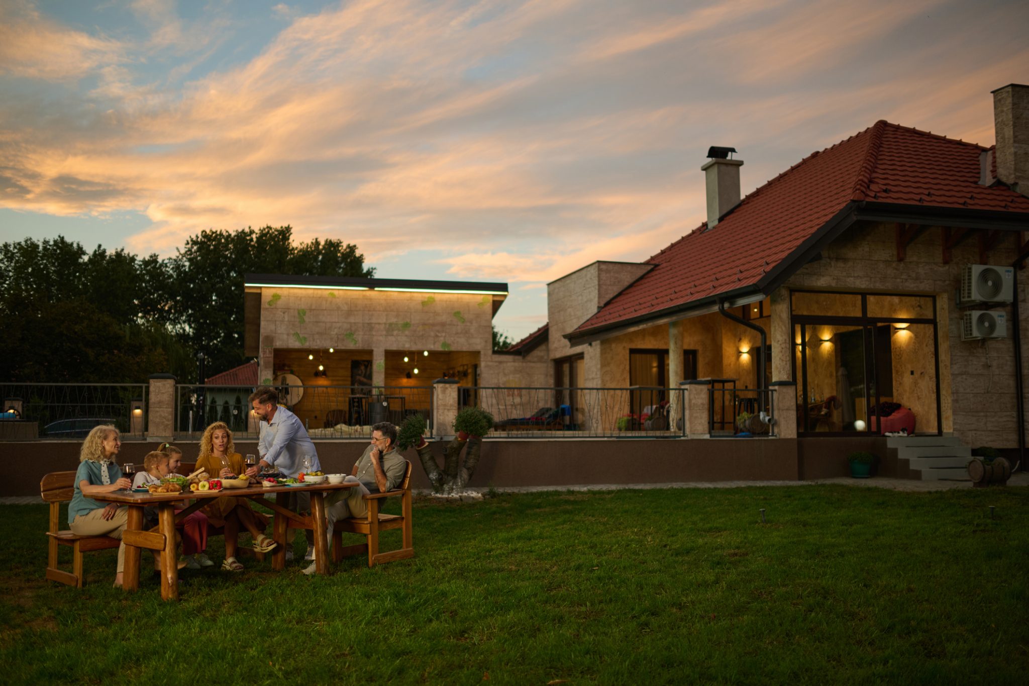 A family enjoying a luxury lifestyle in the backyard of their beautiful custom home. The little things make a difference.